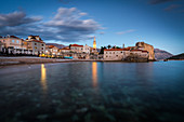 A long exposure during the evening blue hour of the beach and stari grad (old town) of Budva, Montenegro, Europe