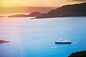 View of Wulaia Bay, Isla Navarino, Murray Channel, with the Stella Australis cruise ship, Patagonia, Chile, South America