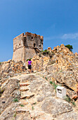 Genoese tower of granite rocks built as fortress of defense framed by blue sky, Porto, Southern Corsica, France, Mediterranean, Europe