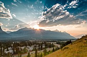 Foothills, mountains and clouds at sunset