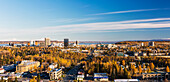 Aerial of downtown Anchorage during autumn with Mt. Foraker and Denali in the background, Southcentral Alaska, USA