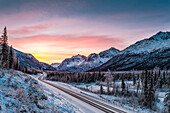 'Dawn colours on Polar Bear Peak and Eagle Peak in Chugach State Park, South-central Alaska in winter; Alaska, United States of America'