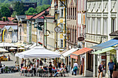 Pedestrian zone with sidewalk cafes and old middle-class houses, Bad Toelz, Upper Bavaria, Bavaria, Germany