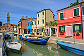 Canal with multi-coloured houses, church in background, Burano, near Venice, UNESCO World Heritage Site Venice, Venezia, Italy