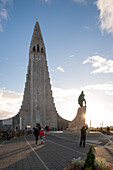 The largest church building in Iceland, the Hallgrimskirkja, with the statue of the legendary explorer Leifur Eiríksson (Eiriksson) by American artist Alexander Stirling Calder, Reykjavik, Iceland, Europe
