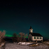 Aurora borealis (Northern Lights) and pingvallakirkja Church at Thingvellir National Park (pingvellir National Park) in winter at night, Pingvellir National Park, Sudurland, Iceland, Europe