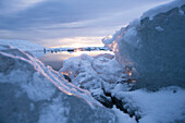 Detail of ice and Jökulsárlón (Jokulsarlon) Glacier Lagoon in snowy winter landscape during the last light of the day, Jökulsárlón (Jokulsarlon), Iceland, Europe