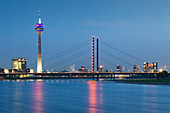 View over the Rhine river to Stadttor, Rheinknie bridge and television tower and Neuer Zollhof (Archite, Duesseldorf, North Rhine-Westphalia, Germany