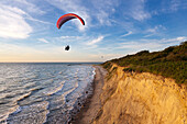 Paraglider at Hohes Ufer near Ahrenshoop, Baltic Sea, Mecklenburg-West Pomerania, Germany