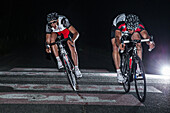 Young men having a race with their racing cycles in the Kitzbühler Alps, Kitzbühlerhorn, Tyrol, Austria