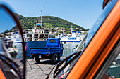 Typical Piaggio pickup van and ships in the harbour of Ischia Porto Ischia, the Bay of Naples, Campania, Italy