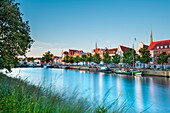 View over river Trave towards old town in the evening light, Luebeck, Baltic coast, Schleswig-Holstein, Germany