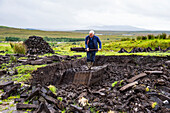 Blocks of peat cut out on a traditional farm, Connemara National Park, County Galway, Connacht, Republic of Ireland, Europe