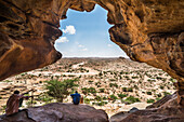 Local guide sitting in one the Laas Geel caves, Somaliland, Somalia, Africa
