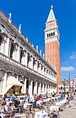 Campanile tower, Piazzetta, and tourists enjoying the cafes of St. Marks Square, Venice, UNESCO World Heritage Site, Veneto, Italy, Europe