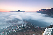 Fog at sunrise above the city of Lecco seen from Monte San Martino, Province of Lecco, Lombardy, Italy, Europe
