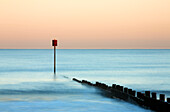 Groyne and post at sunset on Blyth Beach, Blyth, Northumberland, England, United Kingdom, Europe