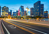 Bridge leading to Brickell Key and Downtown Miami skyline at dusk, Downtown Miami, Miami, Florida, United States of America, North America