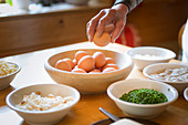 a Chef is preparing a traditional local food with eggs, Bolzano province, South Tyrol, Italy