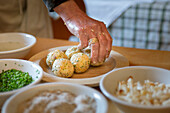 a chef has finished some of homemade dumplings, (canederli), Bolzano province, South Tyrol, Trentino Alto Adige, Italy