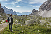 Europe, Italy, Veneto, Belluno, hiker in high Giralba valley on the way to the hut Carducci, Sexten Dolomites