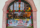The shop window of a typical bakery enriched by Christmas ornaments Kaysersberg Haut-Rhin department Alsace France Europe
