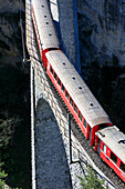 Bernina Express train on Landwasser Viadukt, Filisur, Albula Region, canton of Graubünden, Switzerland, Europe