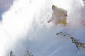 Cody Townsend skis in a cloud of snowy powder