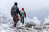 Ice climbers heading down the trail after a day of climbing.