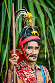 Portrait of senior man wearing traditional costume, Pasola festival, Sumba Island, Indonesia