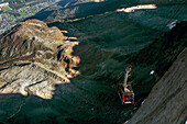 Famous Aiguille du Midi cable car between light and shadow