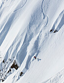 Professional snowboarder Marie France Roy, rides fresh powder on a sunny day while snowboarding in Haines, Alaska.