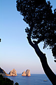 Italy, Amalfi Coast, Capri, Sunset on the Faraglioni. The Faraglioni are Capri's 3 mythical rocks. Seen from the Marina Piccola
