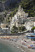 Italy, Amalfi Coast, Landscape, Panorama, Amalfi's shingle beach. Amalfi is a small town whose high white houses are perched on the slopes of the hills in front of a deep blue sea.