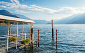Pier overlooking beautiful Lake Como in summer, Lombardy, Italian Lakes, Italy, Europe
