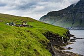 Waterfall into the ocean, Bordoy, Faroe Islands, Denmark, Europe