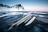 Frozen winter landscape at dusk with Vestrahorn mountains in distance, Stokksnes, South Iceland, Polar Regions