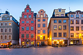 View of colourful buildings on Stortorget, Old Town Square in Gamla Stan at dusk, Stockholm, Sweden, Scandinavia, Europe