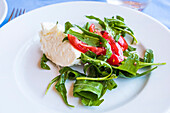 Typical Italian Caprese salad in the restaurant La Fontelina of Capri, island of Capri, Gulf of Naples, Italy