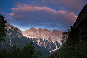Mountains of the Julian Alps in the evening light. Visoki Rokav, Skrlatica, Rakova Spica, Rogljika, Dolkova Spica, Dovski Gamsovec. Gorenjska, Upper Carniola, Triglav National Park, Slovenia
