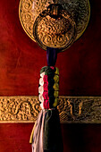 Photograph of ornate tassels decorating monastery at Boudhanath Temple, Kathmandu, Nepal