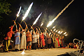 People in costumes make fire show with archery and fire arrows, medieval festival, Eroeffnugsfeier, Schweden