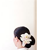 Caucasian woman with flower in hair