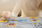 Caucasian woman using tarot cards