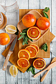 Sliced oranges on cutting board