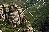 Rock formations overlooking winding road