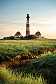 UNESCO World Heritage the Wadden Sea, Westerheversand lighthouse surrounded by salt meadows, Westerhever, Schleswig-Holstein, Germany, North Sea