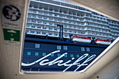 Cruise ship Mein Schiff 6 (TUI Cruises) seen through door opening of tender boat, Baltic Sea, near Rønne, Bornholm, Denmark