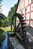Waterwheel of watermill, Mömbris, Spessart-Mainland, Franconia, Bavaria, Germany