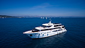 Aerial of cruise ship MS Romantic Star (Reisebüro Mittelthurgau) with sailboats during regatta in Adriatic Sea, near Trogir, Split-Dalmatia, Croatia